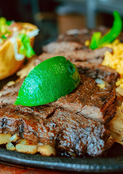 Grilled steak with lime and onions, served at Maria Mia Tex-Mex Cantina in College Station, Texas.