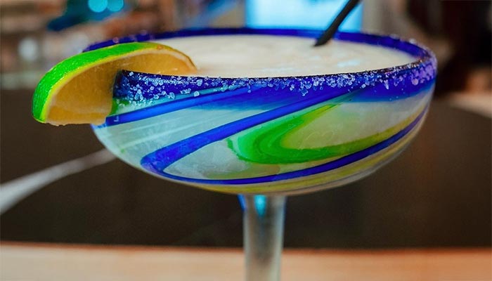 A margarita in a blue-rimmed glass at Maria Mia Tex-Mex Cantina Restaurant Bar, College Station.