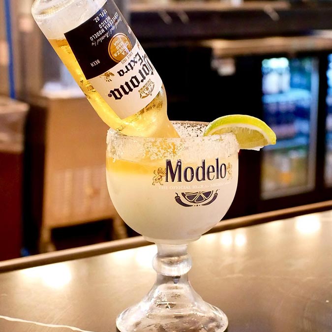 A Modelo glass with lime and Corona at Maria Mia Tex-Mex Cantina Restaurant Bar, College Station.