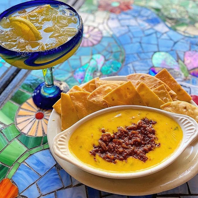 A margarita, tortilla chips, and queso with chorizo at Maria Mia Tex-Mex Cantina, College Station.