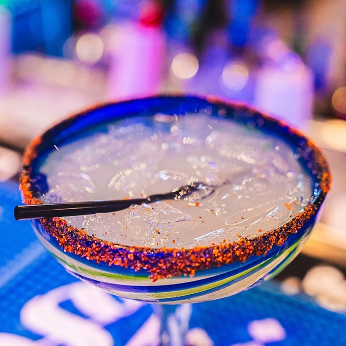 A Texas margarita with chili on the rim, served over ice at Maria Mia Tex-Mex Cantina.