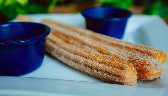 Two churros at Maria Mia Tex-Mex Cantina, served with chocolate sauce, College Station, Texas.