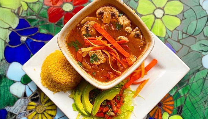 Bowl of vegetable soup, rice, avocado & salad at Maria Mia Tex-Mex Cantina in College Station, Texas.